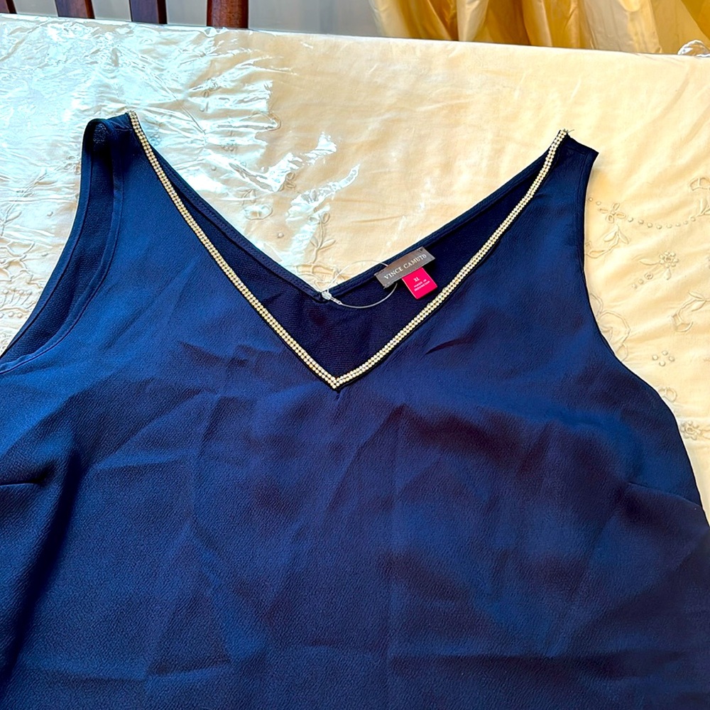 V-neck satin tank top with rhinestone trim. Navy blue.